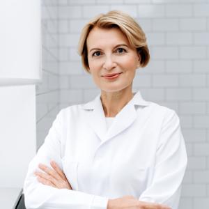 Confident female dentist in a modern clinic, representing general dentistry in Hubbard